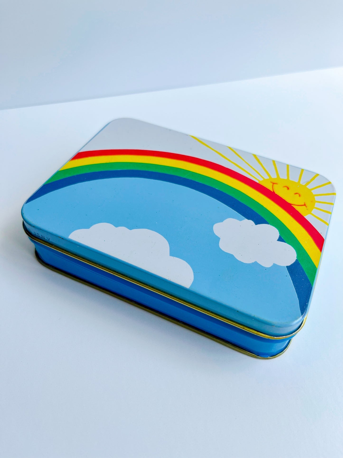 Vintage rainbow tin filled with 80’s themed ephemera & pieces