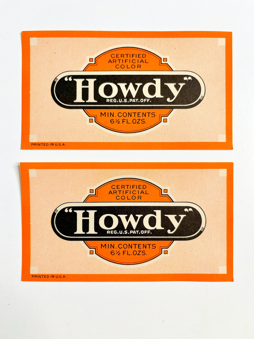 Orange & black vintage “Howdy” soda labels