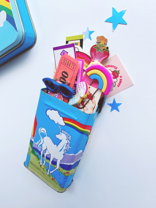 Vintage Unicorn tin filled with 80’s themed ephemera & pieces
